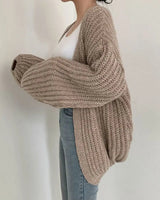 Side view showing balloon sleeves and dropped shoulders of oversized cardigan
