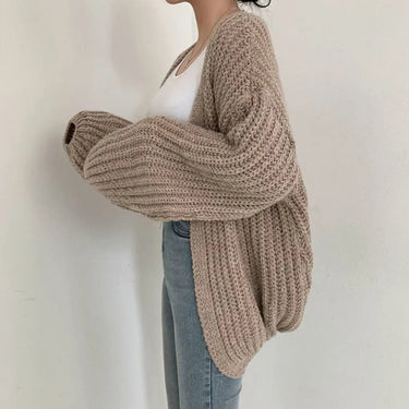 Side view showing balloon sleeves and dropped shoulders of oversized cardigan