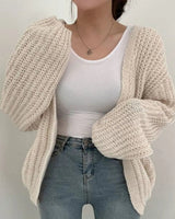 Close-up of chunky ribbed knit texture on the body of the cardigan
