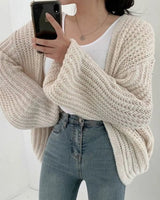 Back view of longline oversized cardigan with balloon sleeves