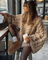 Oversized chunky cable-knit cardigan with dropped shoulders and open front