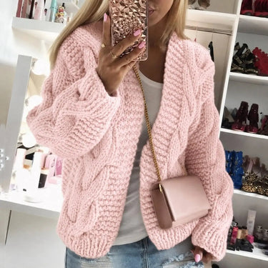 Chunky knit cardigan showing cable texture detail at close range