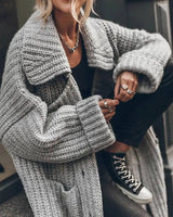 Back view of longline cardigan showing drop-shoulder cut and extended hem