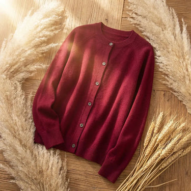 Side view of the hip-length cardigan showing overall silhouette