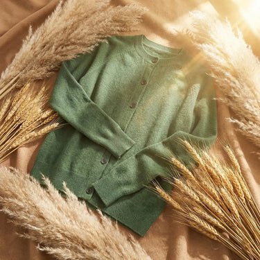 Styled view of the cardigan layered over a collared shirt