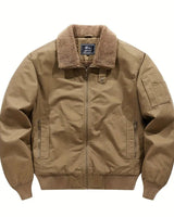 Side view showing ribbed cuffs and hem of the bomber jacket