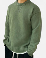 Men's crew neck pullover with solid woven finish, front view
