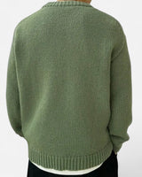 Men's pullover showing ribbed hem detail at the front