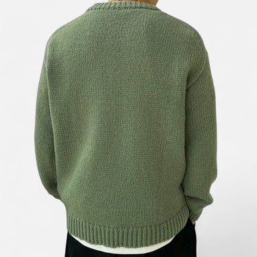 Men's pullover showing ribbed hem detail at the front