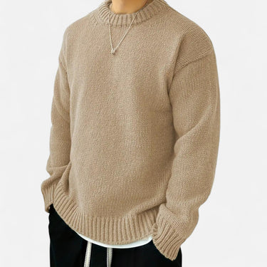 Close-up of ribbed cuff detail on men's crew neck pullover