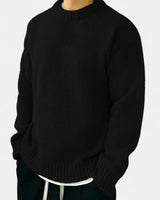 Men's crew neck pullover worn with tailored trousers