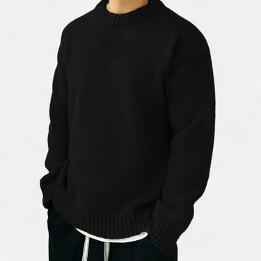 Men's crew neck pullover worn with tailored trousers