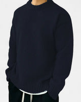 Side view of men's pullover showing ribbed hem and cuffs