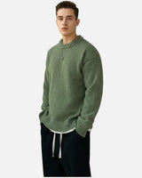 Men's pullover showing ribbed crew neckline detail