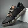 Detail shot showing contrast lacing and stitching on faux leather upper