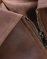 Model wearing a men's harrington jacket styled with jeans and boots