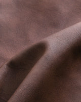 Three-quarter rear view of a men's harrington jacket showing back panel