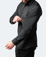 Side view of a men's stretch shirt showing the straight hem and long sleeves