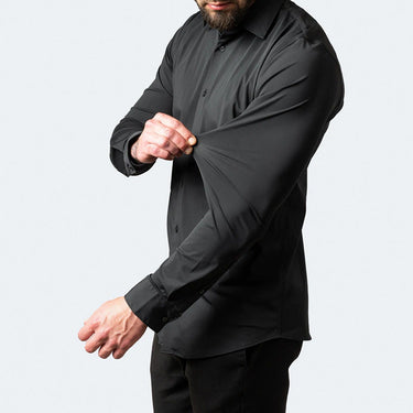 Side view of a men's stretch shirt showing the straight hem and long sleeves