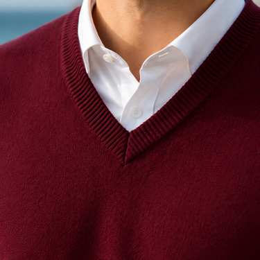 Close-up of ribbed collar and V-neckline detail on men's jumper