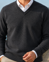 Men's jumper worn under a blazer showing layered smart-casual styling