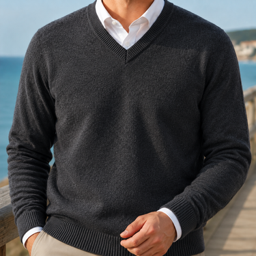 Men's jumper worn under a blazer showing layered smart-casual styling