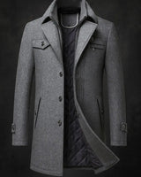 Detail shot of welt pocket, flap pocket, and chest zip pocket on the overcoat