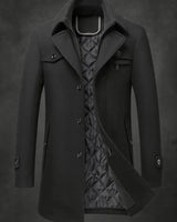 Rear view of the men's single-breasted wool overcoat showing structured back panel