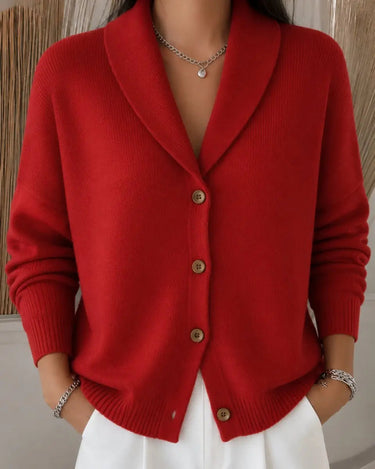Women's knit cardigan worn open over a plain top, side view