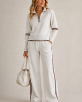 Front view of knitted two-piece set with quarter-zip jumper and wide-leg trousers