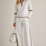 Front view of knitted two-piece set with quarter-zip jumper and wide-leg trousers