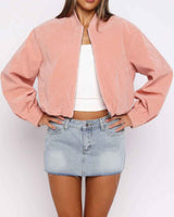 Cropped suede biker jacket with funnel collar and front zip, worn from the front