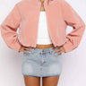 Cropped suede biker jacket with funnel collar and front zip, worn from the front