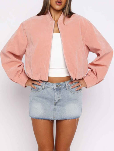 Cropped suede biker jacket with funnel collar and front zip, worn from the front