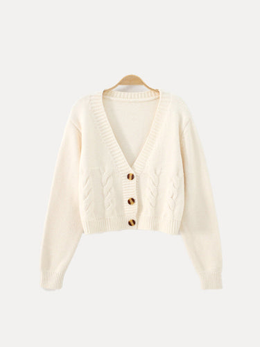 Back view of cropped cable knit cardigan with ribbed hem and cuffs