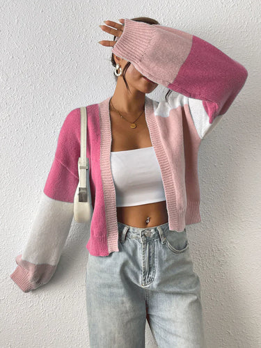 Back view of colour block cardigan showing ribbed hem detail
