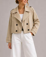 Close-up of the double-breasted button closure and wide lapel collar detail
