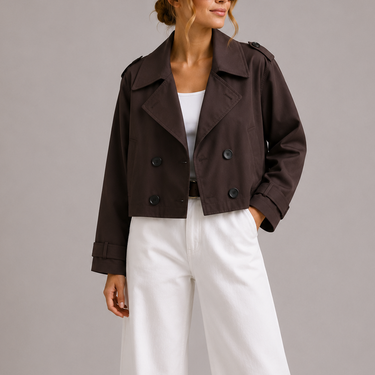 Front view of a cropped double-breasted trench coat with oversized lapels and structured collar