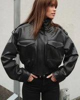 Close-up of the zip front and snap-button placket on the jacket