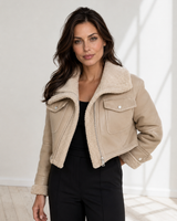 Back view of the structured cropped leather jacket with collar detail