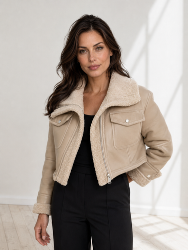 Back view of the structured cropped leather jacket with collar detail