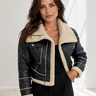 Front view of a cropped leather jacket with oversized fold-over collar and asymmetric zip
