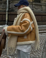 Three-quarter view of jacket showing structured lapel and button front