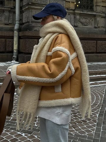 Three-quarter view of jacket showing structured lapel and button front