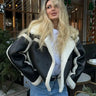 Front view of cropped leather jacket with wide lapel collar and contrast trim