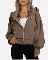 Cropped zip hoodie in white with adjustable hood, styled front view
