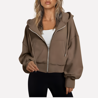 Cropped zip hoodie in white with adjustable hood, styled front view