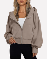 Cropped zip hoodie in black, side view showing relaxed fit and length