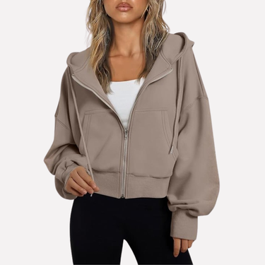 Cropped zip hoodie in black, side view showing relaxed fit and length