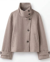 Cropped wool coat with roll cuffs and welt pockets, side or back view